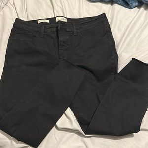 Universal Threads mid rise black distressed skinny jeans